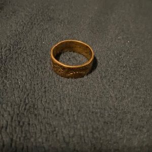 Copper ring with sun and swirl detail